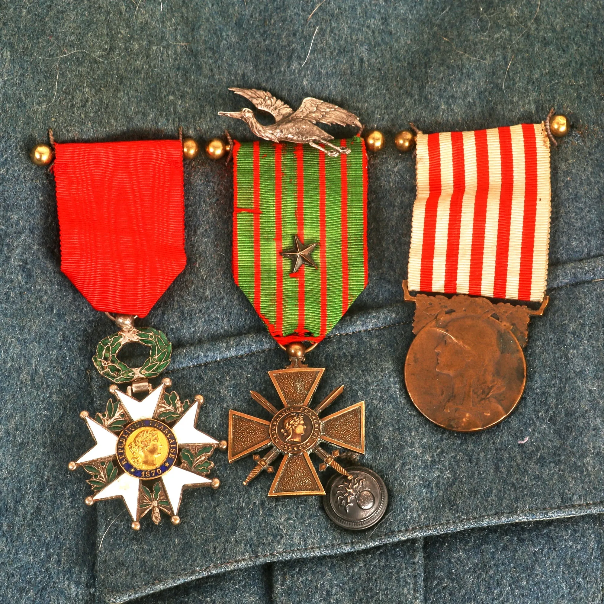 Original France WWI Pilot Armée de l'Air French Air Service Wounded Commandant Officer’s Uniform Set With Tunic, Trousers, Sam Browne Belt, Medals, and Overseas Cap with Squadron Insignia - 'Stork Escadrille N3'